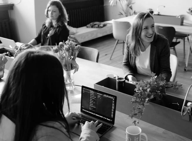 A group of people working together at an office.